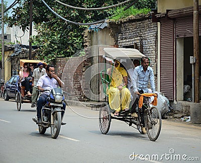 People and vehicles on street in Amritsar, India Editorial Stock Photo