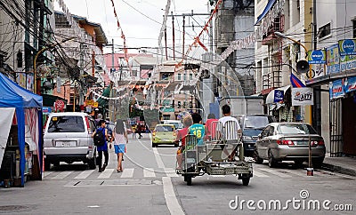 People and vehicles on street at Baclaran in Manila, Philippines Editorial Stock Photo