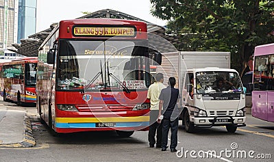 People and vehicles on street in Kuala Lumpur, Malaysia Editorial Stock Photo