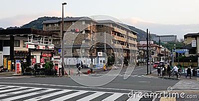 People and vehicles on street in Kyoto, Japan Editorial Stock Photo