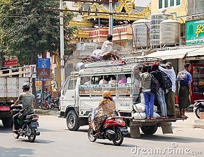 People and vehicles on street in Yangon, Myanmar Editorial Stock Photo