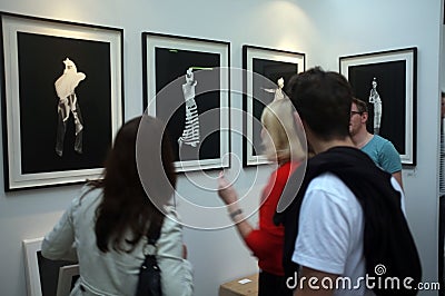 People viewing art in a gallery Editorial Stock Photo