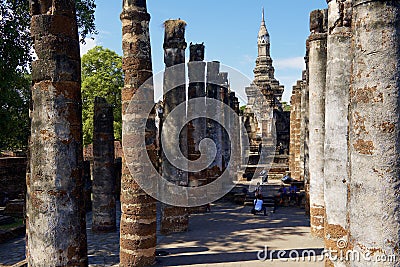People visit ruins of Wat Mahathat in Sukhothai Historical park in Sukhothai, Thailand. Editorial Stock Photo