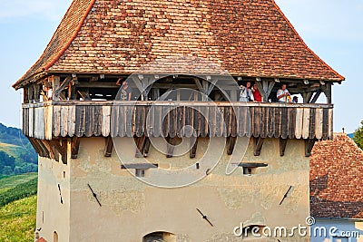 People visiting a lookout tower in the fortified church of Alma Vii village, during a brunch and wine tasting event Editorial Stock Photo