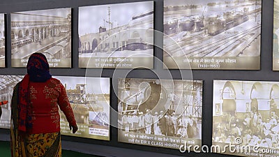 People visiting a second world war photo gallery exhibition at a history museum. Editorial Stock Photo