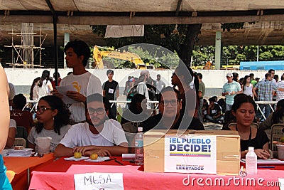 People voting on Venezuelan national consultation called by the National Assembly Editorial Stock Photo