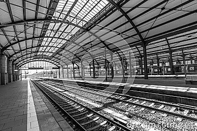 people wait in the train station for departure in classicistic train station in Wiesbaden, the smaller copy of Frankfurt Train Editorial Stock Photo