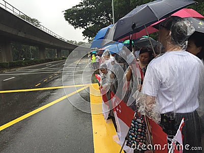 People waiting by side of road for the state funeral procession of ex prime minister of singapore Mr Lee Kuan Yew Editorial Stock Photo