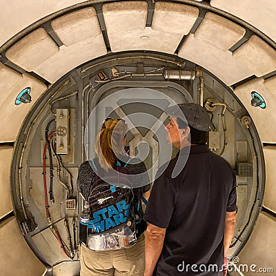 People waiting to get on the Millenium Falcon Smuggler`s Run ride at the Star Wars Galaxy`s Edge Editorial Stock Photo