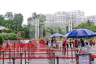 People waiting to join the queue to visit the Istana, during the Open House. The public is allowed access Editorial Stock Photo