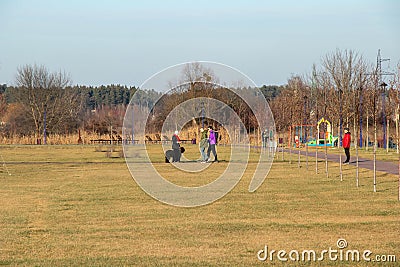 People walk along the new embankment of the Irpin river Editorial Stock Photo