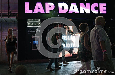 People walk down the street in Magaluf Editorial Stock Photo