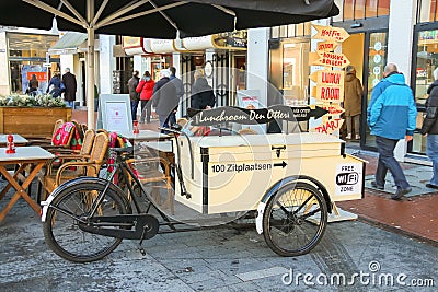 People walk past the carriage for fast food Editorial Stock Photo