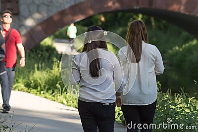 people walk in summer park Editorial Stock Photo