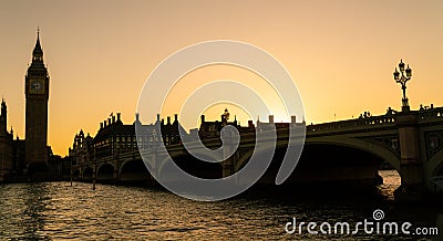 People walking across Westminster Bridge, Big Ben at Sunset in London, England Stock Photo