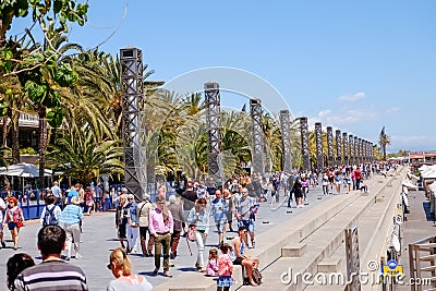 People walking along a marina bay near the beach in Barcelona. Spain. Editorial Stock Photo