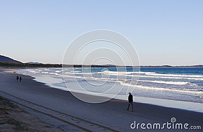 People walking on the beach at Crowdy National Park, NSW, Australia Stock Photo