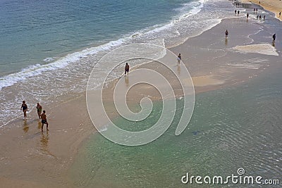 People walking on the beach of La Concha in the city of Donostia Editorial Stock Photo