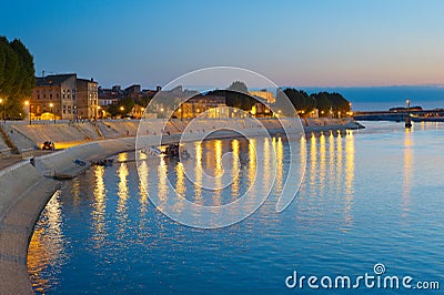 People walking embankment Arles, France Stock Photo