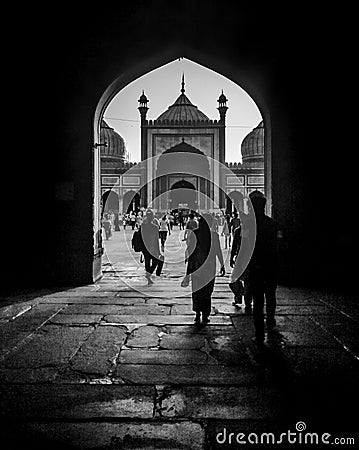 People walking by the entry of Jama Masjid Editorial Stock Photo