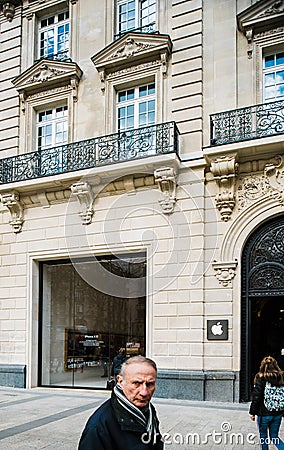 People walking in front of the iconic Apple Computers Store on Champs Elysee Editorial Stock Photo