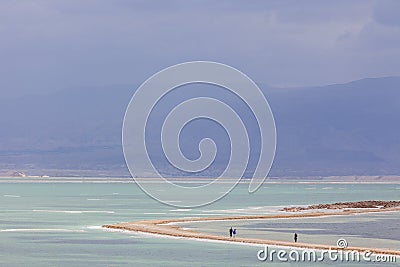 People walking on headland on stormy day at Dead Sea Stock Photo
