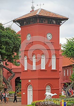 People are walking nearly the Clock tower in Malacca Editorial Stock Photo