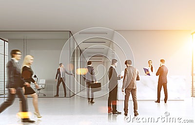 People walking in an office lobby Stock Photo