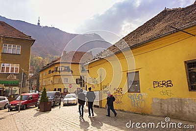 People walking on one of the main streets in the historical center of the city. The Brasov Editorial Stock Photo