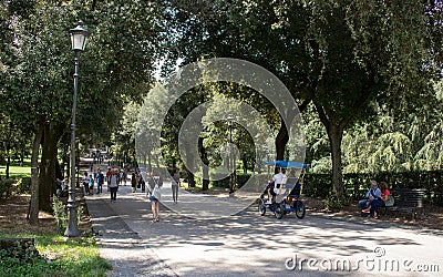 People walking in a park. Editorial Stock Photo