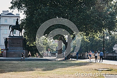 People walking past an equestrian statue of the Duke of Wellington, London, UK Editorial Stock Photo