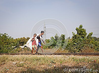 People walking on rail track in Mandalay, Myanmar Editorial Stock Photo