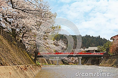 People walking on red Nakabashi Bridge during Spring in Takayama, Japan Editorial Stock Photo