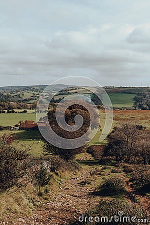 People walking on the scenic path to Crook Peak in The Mendip Hills, Somerset, UK Editorial Stock Photo