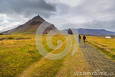 People walking on the south coast of the Snaefellsnes peninsula, Iceland Editorial Stock Photo