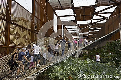 People walking on th suspended net at the external of Brazilian Pavilion Editorial Stock Photo