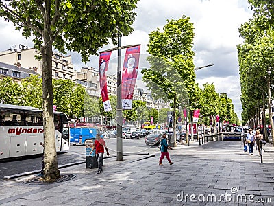People walking and visiting the famous street in Paris, the Champs dÂ´elysees in the heart of Paris Editorial Stock Photo