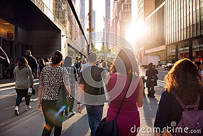 People walking from the work at the street in New York City at sunset time Editorial Stock Photo