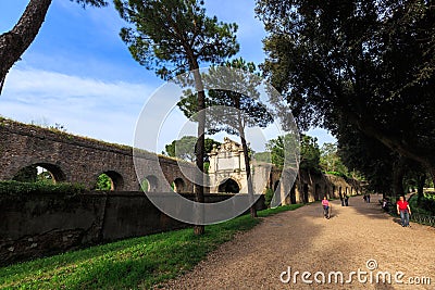 People walks along Aurelian wall around Ancient Rome on Aurelia Antica street Editorial Stock Photo