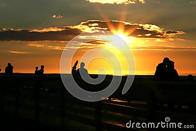 People watching the Sunset on San Clemente Pier Stock Photo