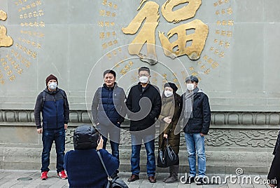 People wearing a face masks to protecting themself because of epidemicCOVID-19 in China Editorial Stock Photo