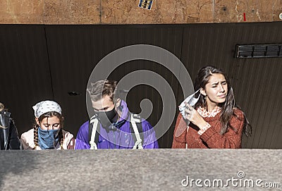 People wearing protective masks during the corona virus outbreak Editorial Stock Photo