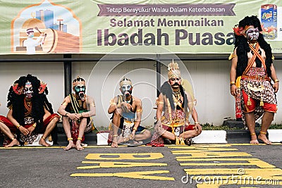 people wearing puppet costumes are sitting waiting for their turn to perform Editorial Stock Photo