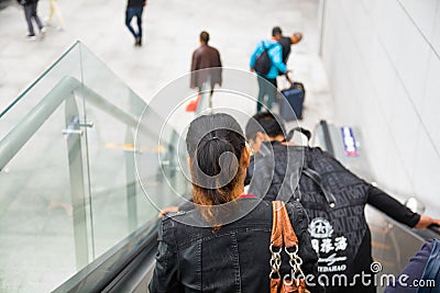 People who walk down on the escalator. Editorial Stock Photo