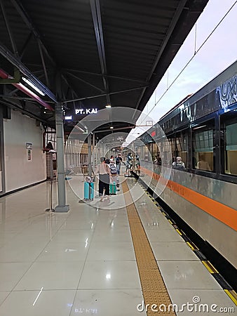 People who walk the platform of the train station Editorial Stock Photo