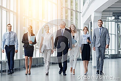 Business people walking along office building Stock Photo