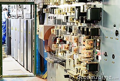 People work in a relay room at a power plant Editorial Stock Photo