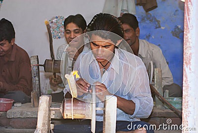 People work in a workshop creating traditional floral marble design, produced by muslim Bharai community in Agra, India. Editorial Stock Photo