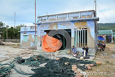People working at the old house in Phan Rang, Vietnam Editorial Stock Photo