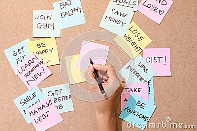 People write down an important note, using on the paper stickers post it Stock Photo